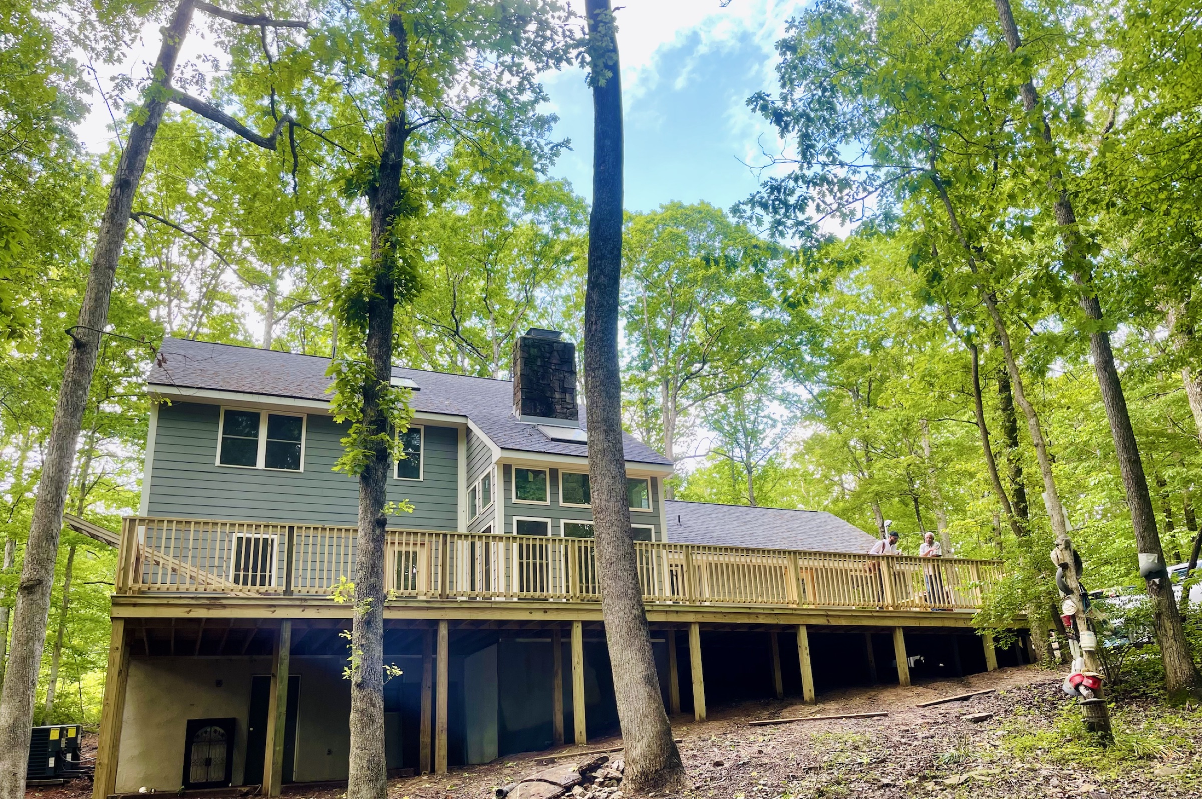 The Benjamin House — a private home with a 63-foot deck elevated among the hardwood forest canopy on the Sewanee Domain